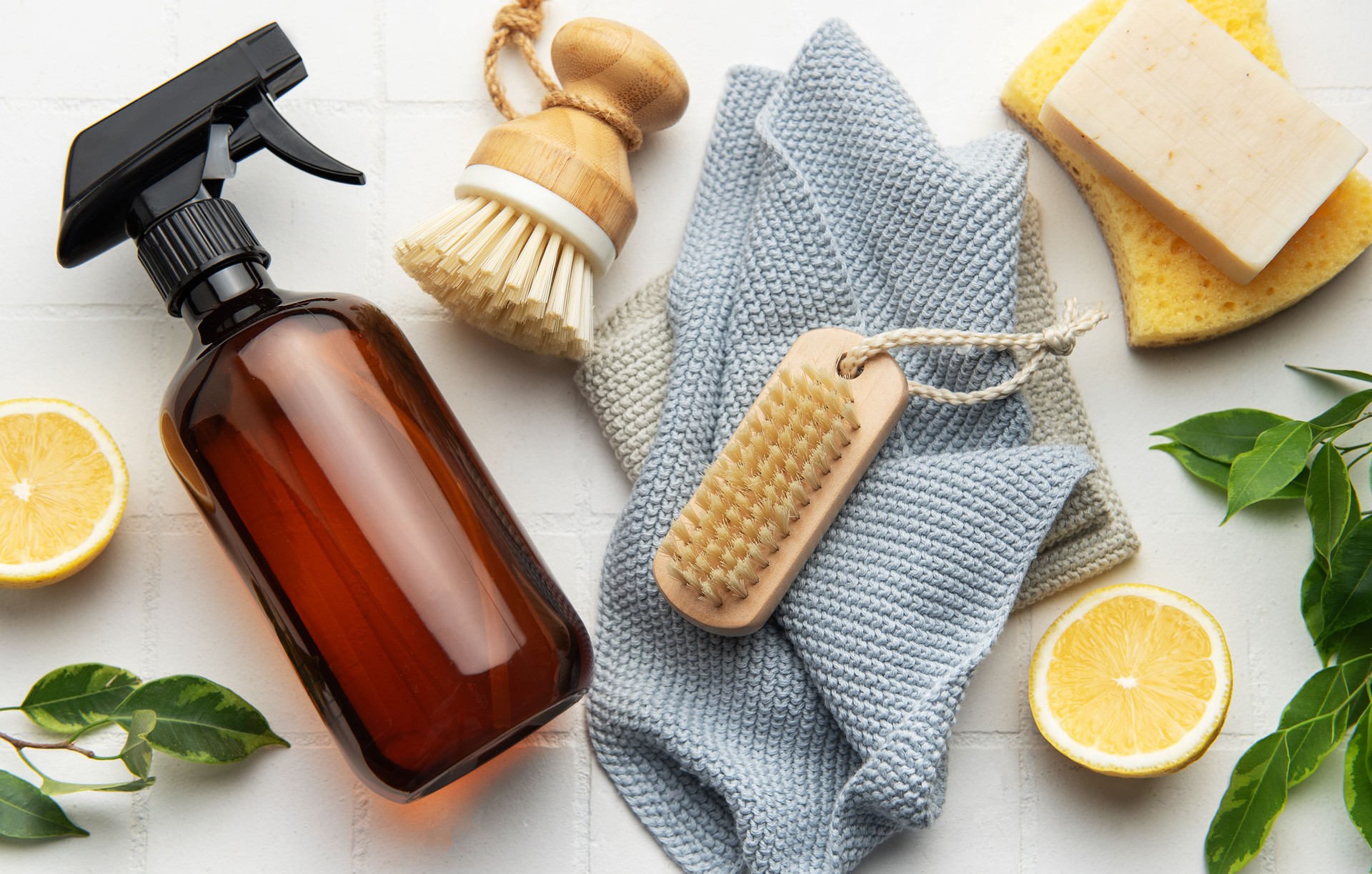 Eco friendly cleaning products promoting sustainable lifestyle on white tile background