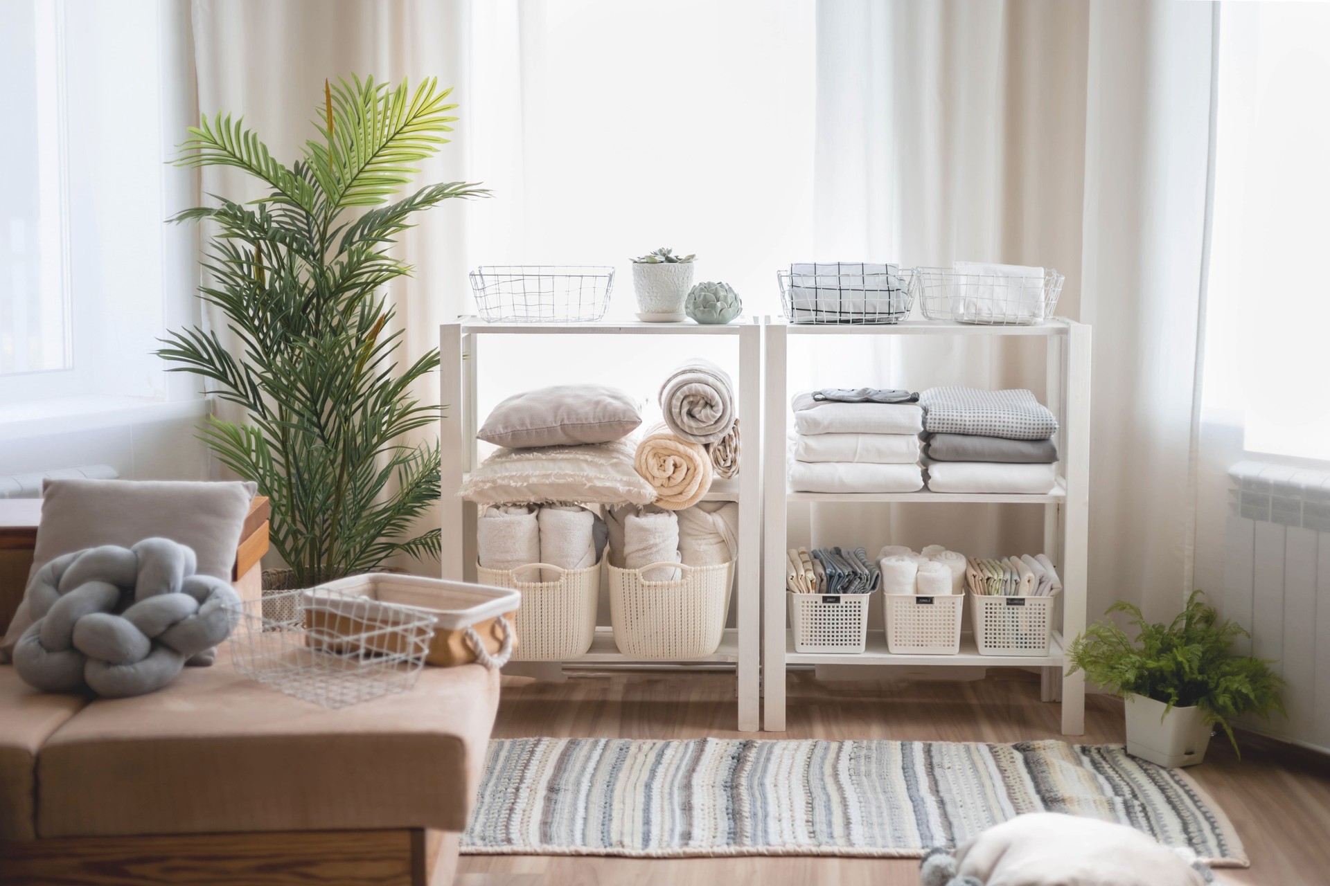 Wardrobe in the bedroom with neatly folded linen vertical storage and stacks.